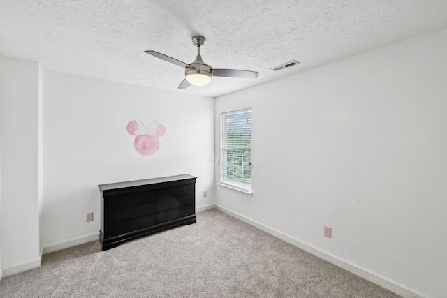 325 Golfview Ln, Springfield, TN 37172 - unfurnished bedroom featuring carpet flooring, baseboards, ceiling fan, and a textured ceiling