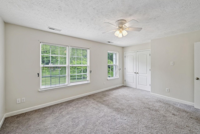 325 Golfview Ln, Springfield, TN 37172 - unfurnished bedroom with baseboards, carpet flooring, a textured ceiling, a closet, and a ceiling fan