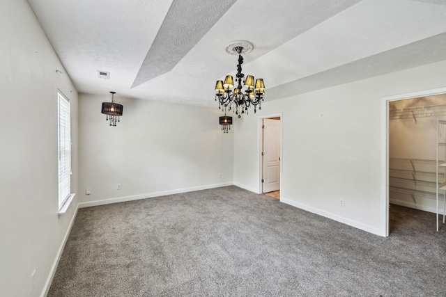 325 Golfview Ln, Springfield, TN 37172 - spare room featuring a textured ceiling, carpet flooring, baseboards, and a chandelier