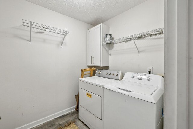 325 Golfview Ln, Springfield, TN 37172 - laundry room featuring cabinet space, separate washer and dryer, light wood-style floors, baseboards, and a textured ceiling