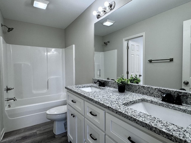 62 Sundance Dr, Lawrenceburg, TN 38464 - bathroom featuring wood finished floors, toilet, tub / shower combination, and double vanity