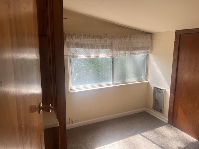 207 Powell St, Decherd, TN 37324 - carpeted empty room with vaulted ceiling and baseboards