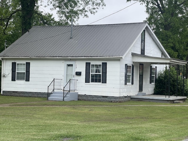 207 Powell St, Decherd, TN 37324 - view of front of home with crawl space, a front lawn, and metal roof