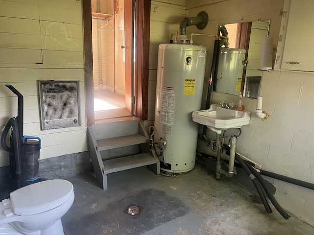 207 Powell St, Decherd, TN 37324 - utility room featuring water heater, a sink, and heating unit