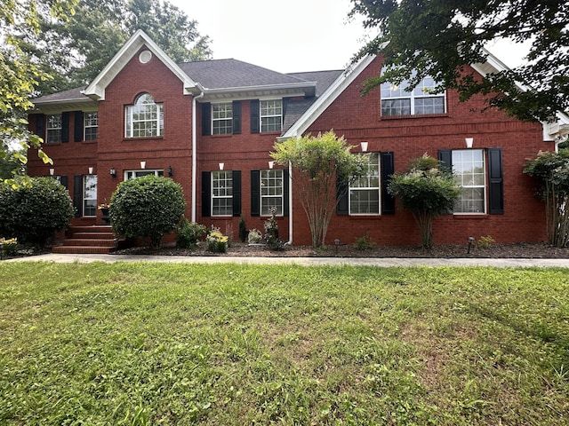 6900 Snow View Ln, Ooltewah, TN 37363 - colonial-style house with a front lawn and brick siding