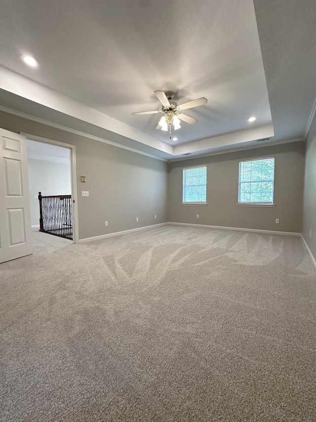 6900 Snow View Ln, Ooltewah, TN 37363 - spare room with a tray ceiling, baseboards, ceiling fan, light colored carpet, and recessed lighting