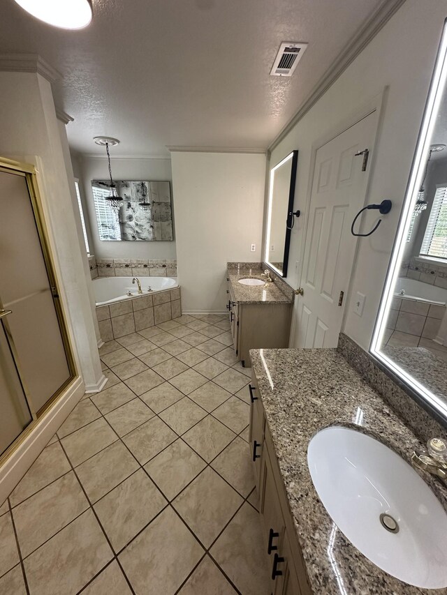 6900 Snow View Ln, Ooltewah, TN 37363 - bathroom with a textured ceiling, two vanities, a stall shower, a bath, and tile patterned floors