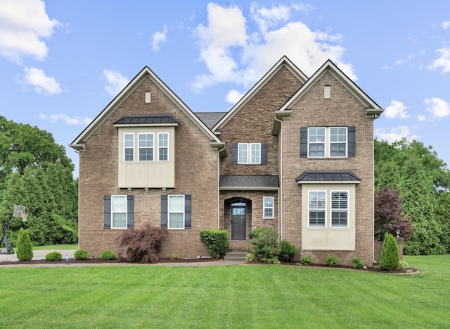 810 Pine Terrace Dr, Brentwood, TN 37027 - view of front of home featuring a standing seam roof, brick siding, a front lawn, and metal roof