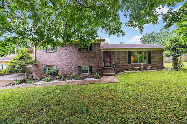 900 Camellia Dr, Columbia, TN 38401 - tri-level home with a front yard and brick siding