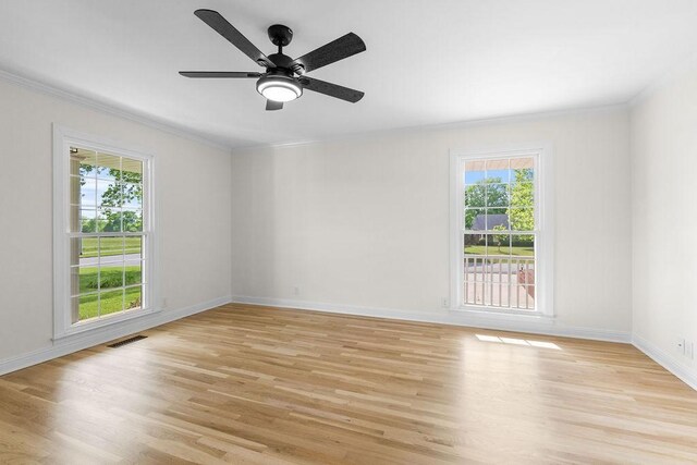 754 Veterans Pkwy, Murfreesboro, TN 37128 - empty room with crown molding, plenty of natural light, light wood-style floors, baseboards, and ceiling fan