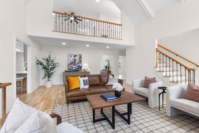 754 Veterans Pkwy, Murfreesboro, TN 37128 - living area with a high ceiling, wood finished floors, stairs, and baseboards