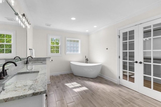 754 Veterans Pkwy, Murfreesboro, TN 37128 - full bathroom with crown molding, baseboards, healthy amount of natural light, french doors, and a freestanding tub