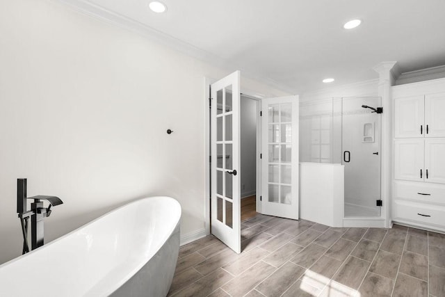 754 Veterans Pkwy, Murfreesboro, TN 37128 - full bathroom featuring french doors, ornamental molding, a shower stall, recessed lighting, and a freestanding tub