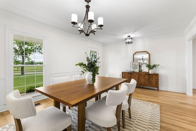754 Veterans Pkwy, Murfreesboro, TN 37128 - dining space with a chandelier, light wood-style floors, crown molding, and baseboards