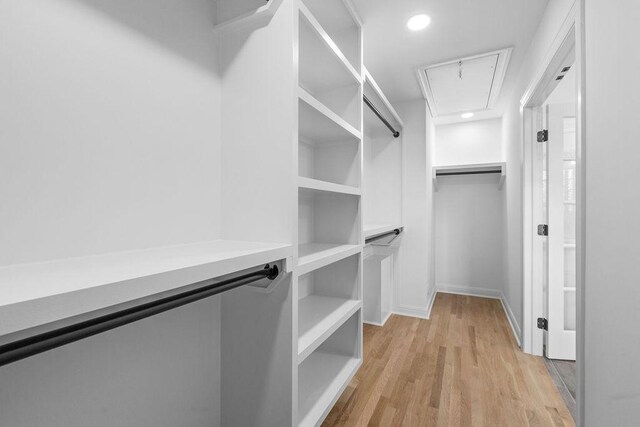 754 Veterans Pkwy, Murfreesboro, TN 37128 - spacious closet featuring attic access and light wood finished floors