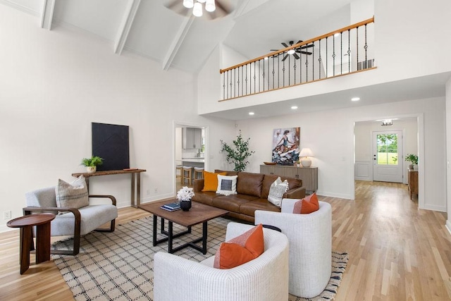 754 Veterans Pkwy, Murfreesboro, TN 37128 - living room with high vaulted ceiling, light wood-type flooring, a ceiling fan, beam ceiling, and baseboards