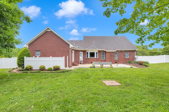 back of house with a patio and brick siding