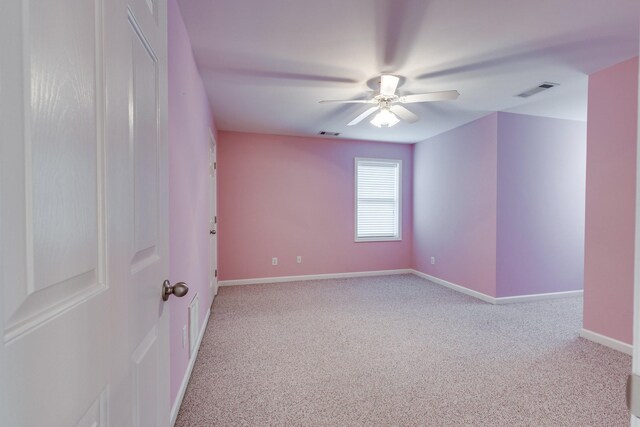 unfurnished room featuring ceiling fan, carpet floors, and baseboards
