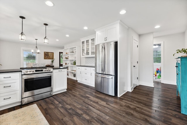1244 Westfield Rd, Dickson, TN 37055 - kitchen with appliances with stainless steel finishes, open shelves, dark countertops, dark wood-type flooring, and white cabinetry