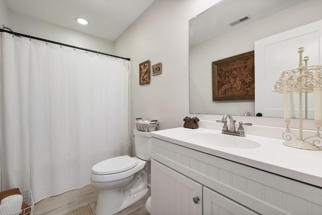 1244 Westfield Rd, Dickson, TN 37055 - full bath with vanity, toilet, wood finished floors, recessed lighting, and a shower with shower curtain