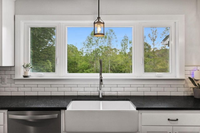 1244 Westfield Rd, Dickson, TN 37055 - kitchen featuring stainless steel dishwasher, a sink, white cabinets, decorative backsplash, and hanging light fixtures