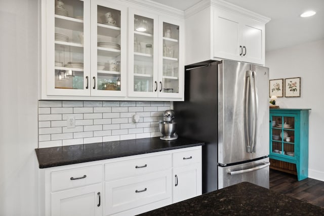 1244 Westfield Rd, Dickson, TN 37055 - kitchen with freestanding refrigerator, dark wood-type flooring, backsplash, glass insert cabinets, and white cabinetry