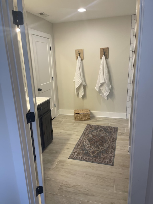 1244 Westfield Rd, Dickson, TN 37055 - bathroom with vanity, baseboards, recessed lighting, and wood finished floors