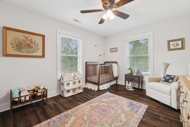 1244 Westfield Rd, Dickson, TN 37055 - bedroom featuring multiple windows, wood finished floors, and a nursery area