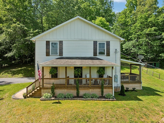 1244 Westfield Rd, Dickson, TN 37055 - view of front of house with covered porch, roof with shingles, and board and batten siding