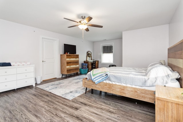 bedroom with wood finished floors and a ceiling fan