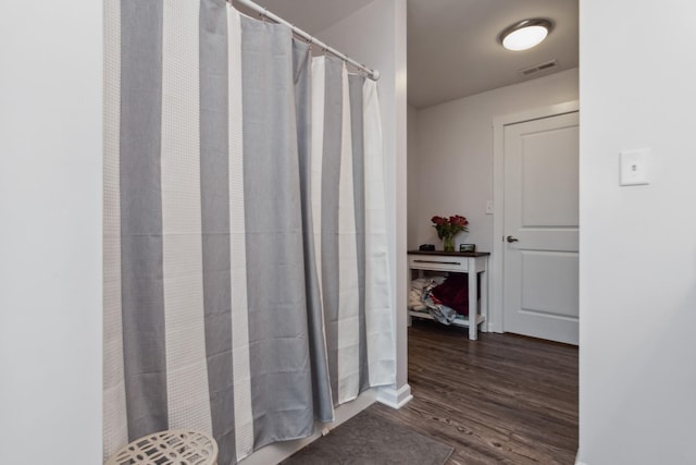 full bathroom with wood finished floors
