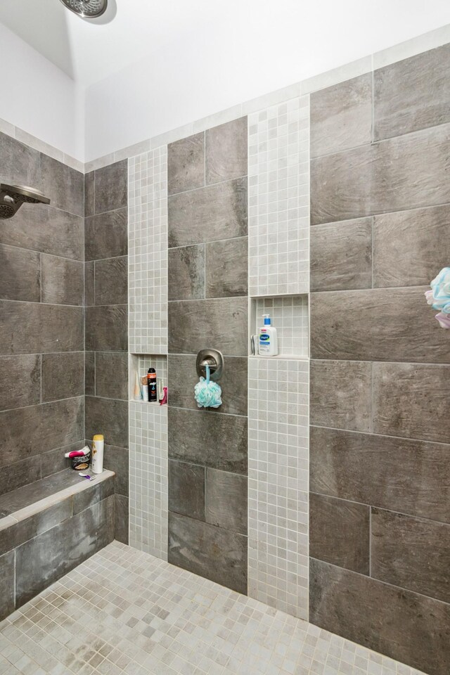 bathroom with tiled shower
