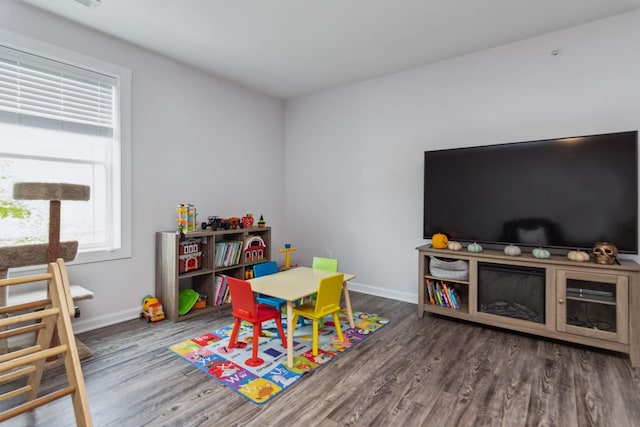 game room featuring wood finished floors and baseboards