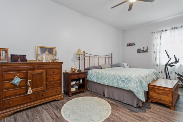 bedroom featuring wood finished floors and ceiling fan