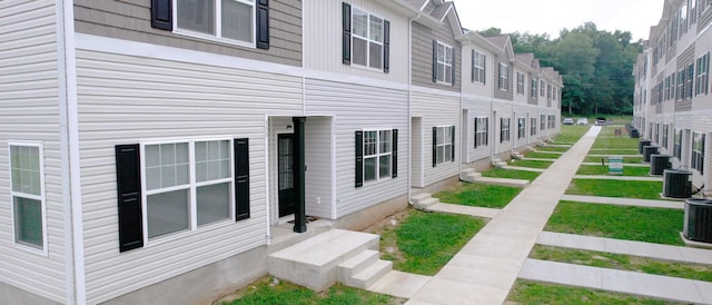 view of side of property with central AC unit