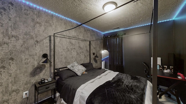bedroom featuring a textured ceiling