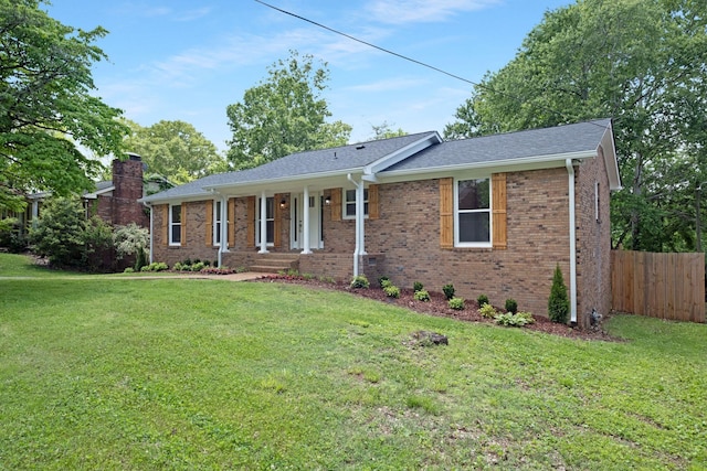 ranch-style home featuring brick siding and a porch