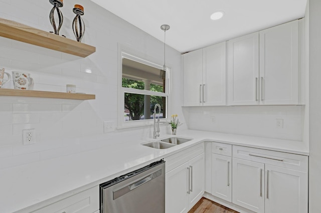 kitchen featuring stainless steel dishwasher, open shelves, a sink, white cabinetry, and recessed lighting
