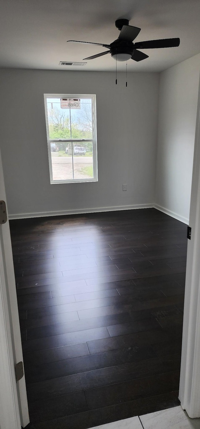 830 Finley Beech Rd, Lewisburg, TN 37091 - spare room with a ceiling fan, dark wood-type flooring, and baseboards