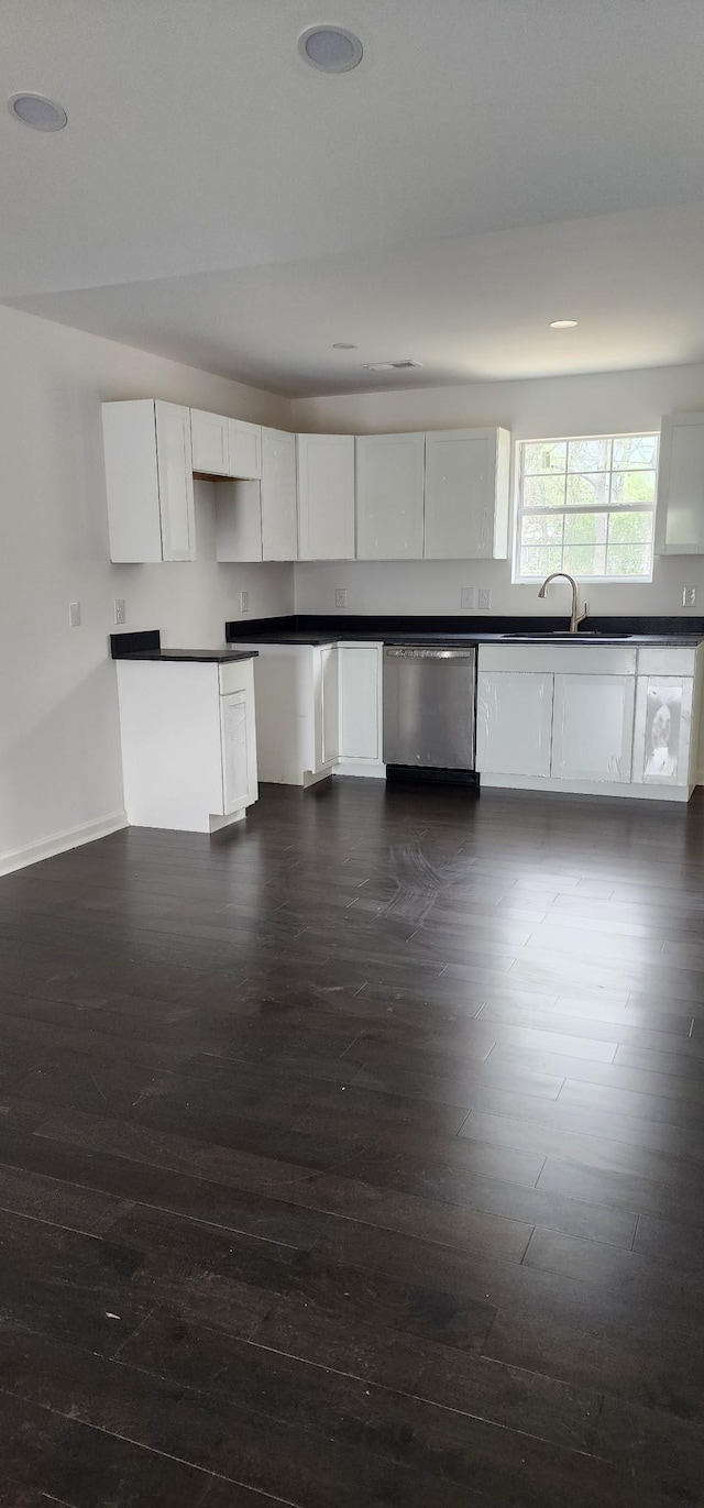 830 Finley Beech Rd, Lewisburg, TN 37091 - kitchen featuring stainless steel dishwasher, dark wood-style flooring, white cabinets, baseboards, and dark countertops