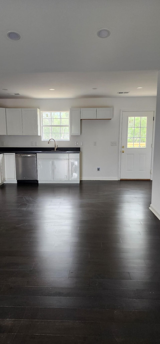 830 Finley Beech Rd, Lewisburg, TN 37091 - kitchen featuring stainless steel dishwasher, dark countertops, dark wood-style flooring, white cabinetry, and recessed lighting