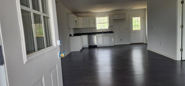 830 Finley Beech Rd, Lewisburg, TN 37091 - kitchen featuring dark countertops, stainless steel dishwasher, dark wood-style flooring, white cabinets, and a sink