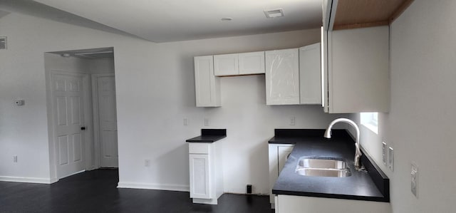 830 Finley Beech Rd, Lewisburg, TN 37091 - kitchen with a sink, white cabinets, dark countertops, and dark wood-style floors