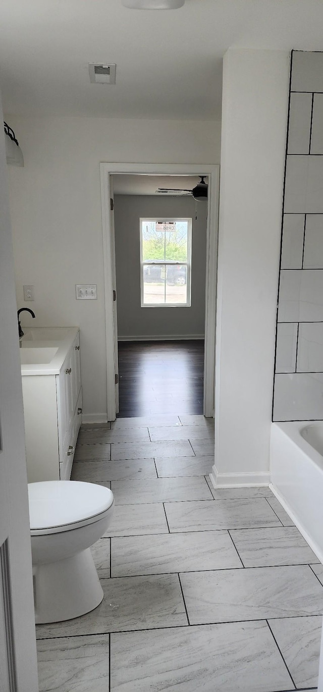 830 Finley Beech Rd, Lewisburg, TN 37091 - full bathroom featuring toilet, baseboards, vanity, and wood finished floors