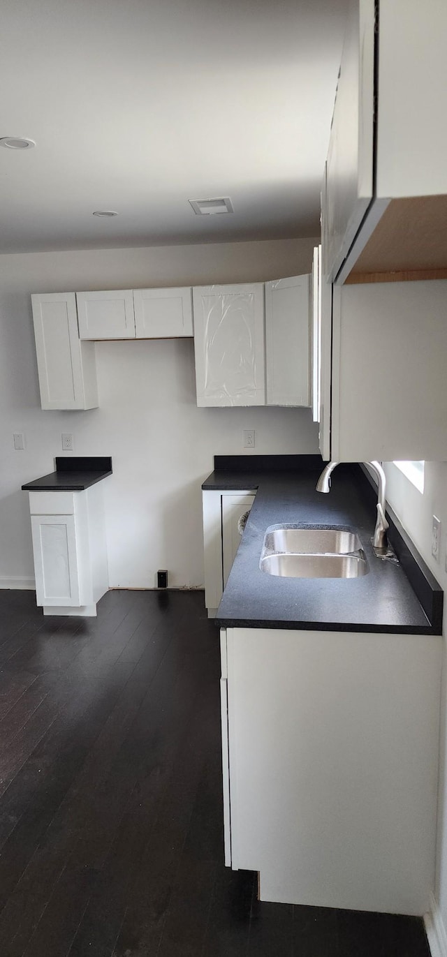 830 Finley Beech Rd, Lewisburg, TN 37091 - kitchen with a sink, white cabinetry, dark countertops, and dark wood-style floors