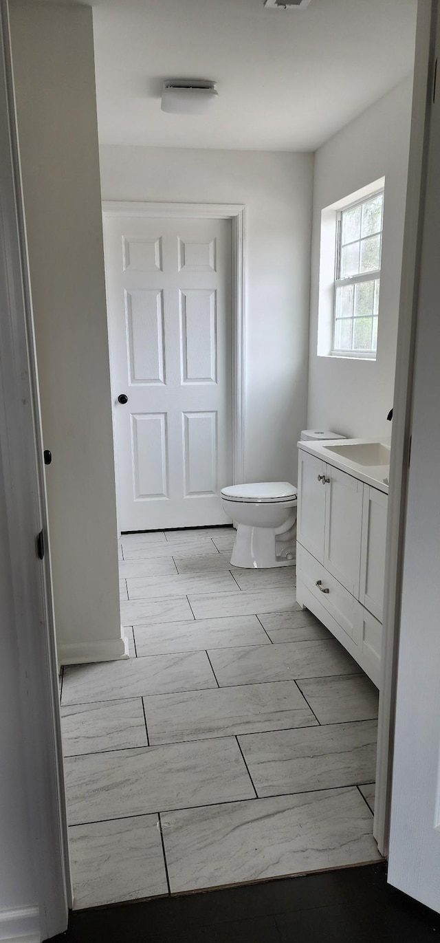 830 Finley Beech Rd, Lewisburg, TN 37091 - half bathroom with toilet, vanity, and wood tiled floors