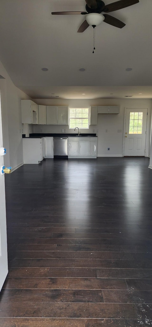 830 Finley Beech Rd, Lewisburg, TN 37091 - unfurnished living room with dark wood-type flooring, a sink, a ceiling fan, and a wall mounted AC