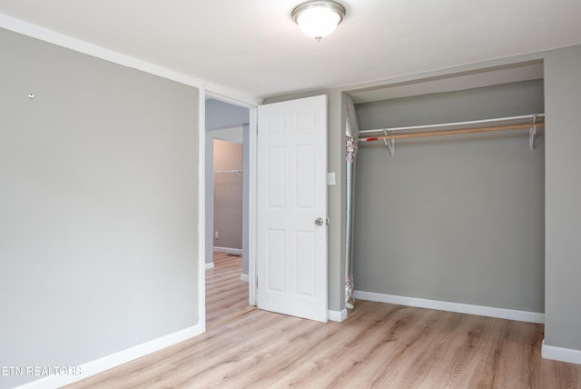 112 Pelham Rd, Knoxville, TN 37914 - unfurnished bedroom with wood finished floors, a closet, and baseboards