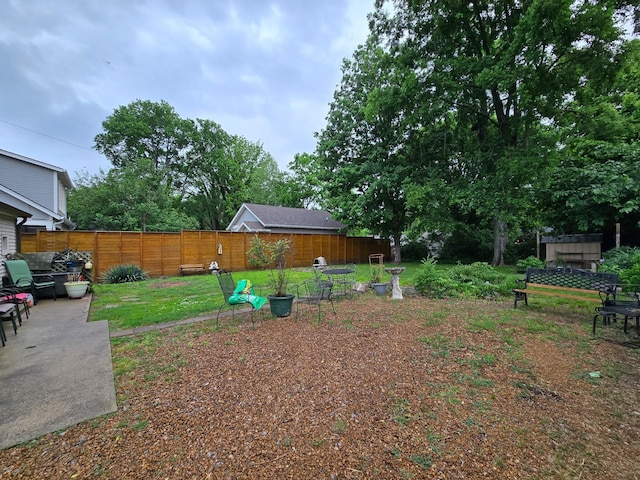 fenced backyard with a patio