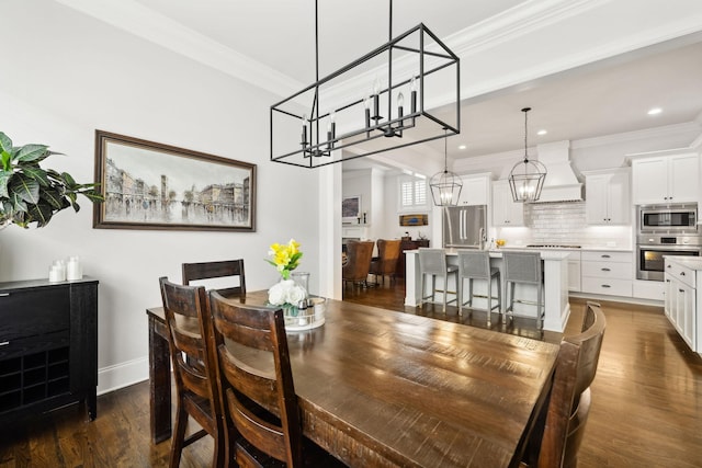 4091 Camberley St, Franklin, TN 37064 - dining space with a chandelier, crown molding, dark wood-type flooring, recessed lighting, and baseboards